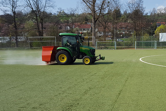 Resanding artificial turf pitch